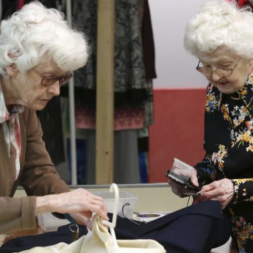 Elderly Women organizing clothing