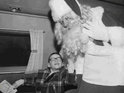 Old-time photo of Santa and child