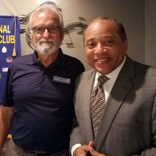 Two men posing for picture
