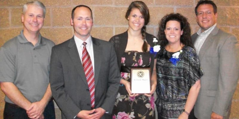 Teenager Accepting Award with family