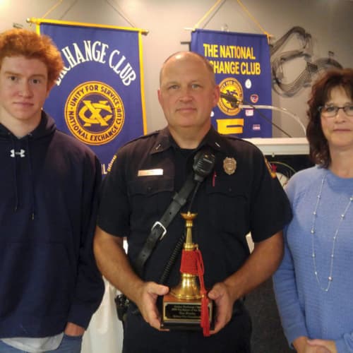 Firefighter holding award